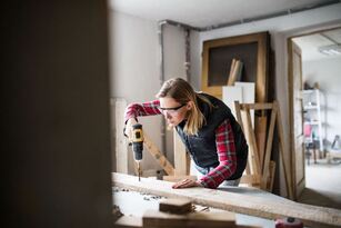 Young woman working on some carpentry